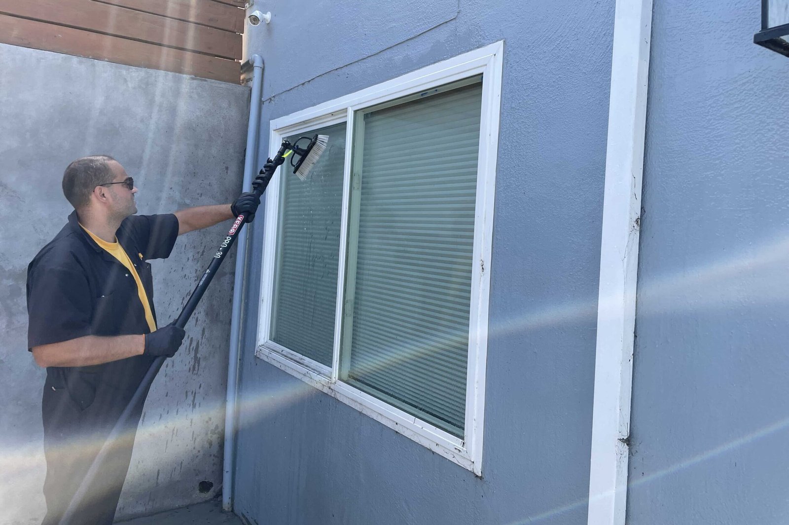 Cleaning a window in Los Altos, CA