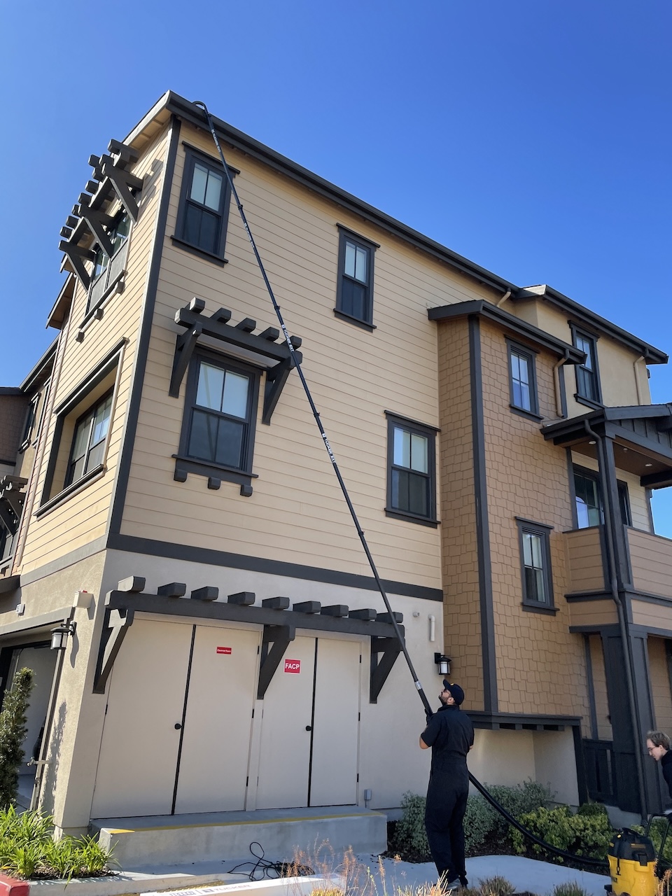Gutter cleaning with vacuum poles.