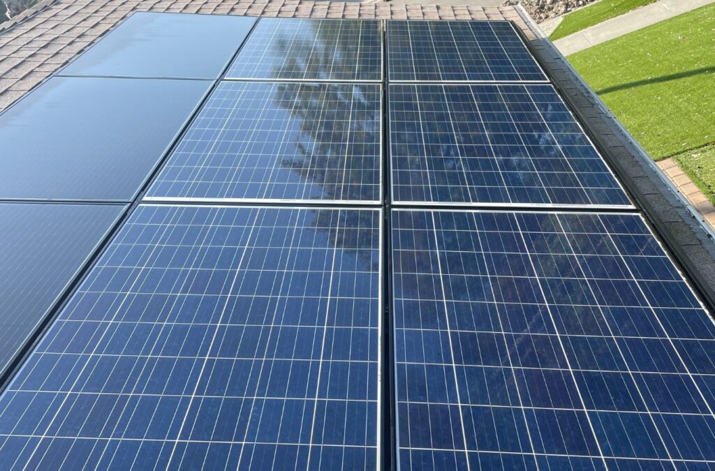 A technician showcasing the benefits of professional solar panel cleaning in Sunnyvale, CA.