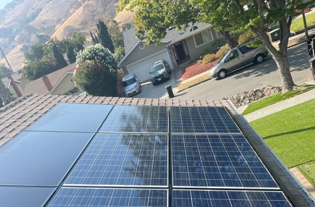 A technician performing solar panel washing in Mountain View, showcasing why Slon Exterior Care is the top choice for the job. Solar Panel Washing Near Me.