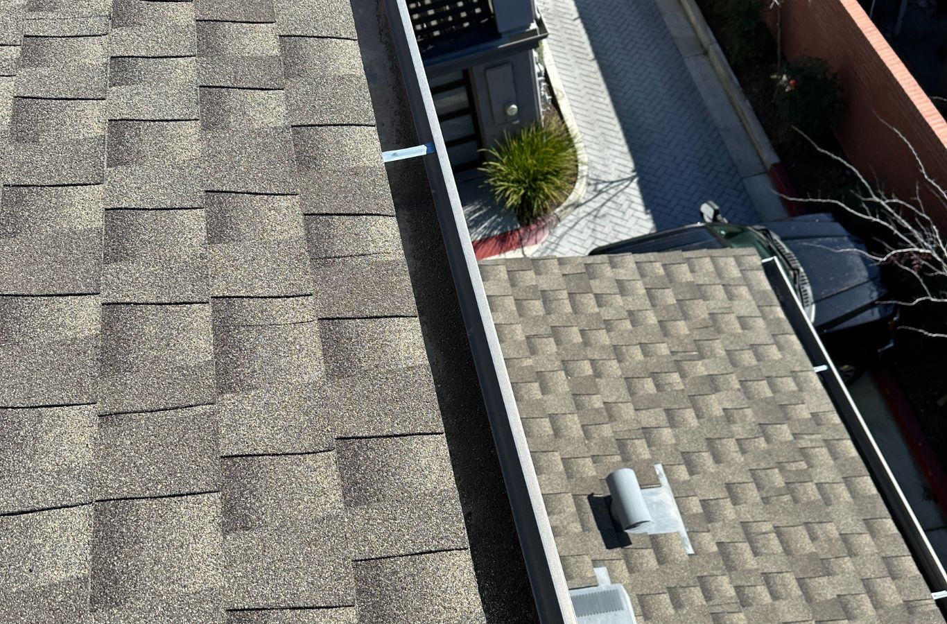 A Slon Exterior Care employee providing expert gutter cleaning services in Mountain View, CA, ensuring clean, debris-free gutters for a safer home.