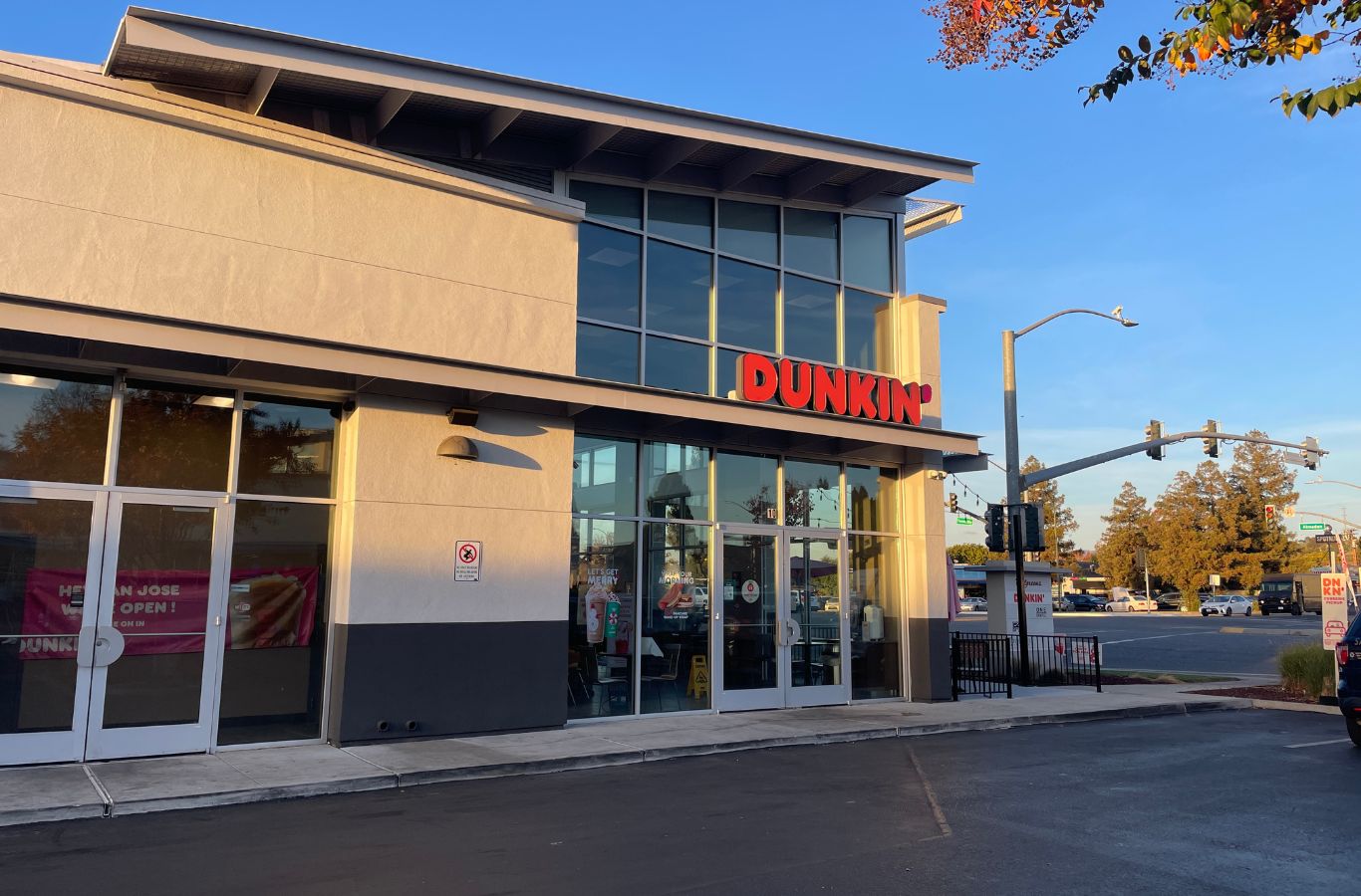 A Slon Exterior Care professional cleaning windows in Mountain View, CA, ensuring streak-free and clear results with precision tools.