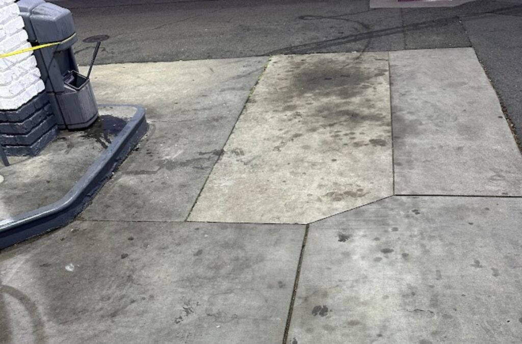 A Slon Exterior Care team member deep-cleaning a gas station in San Jose, CA, ensuring a safe and inviting environment for customers.