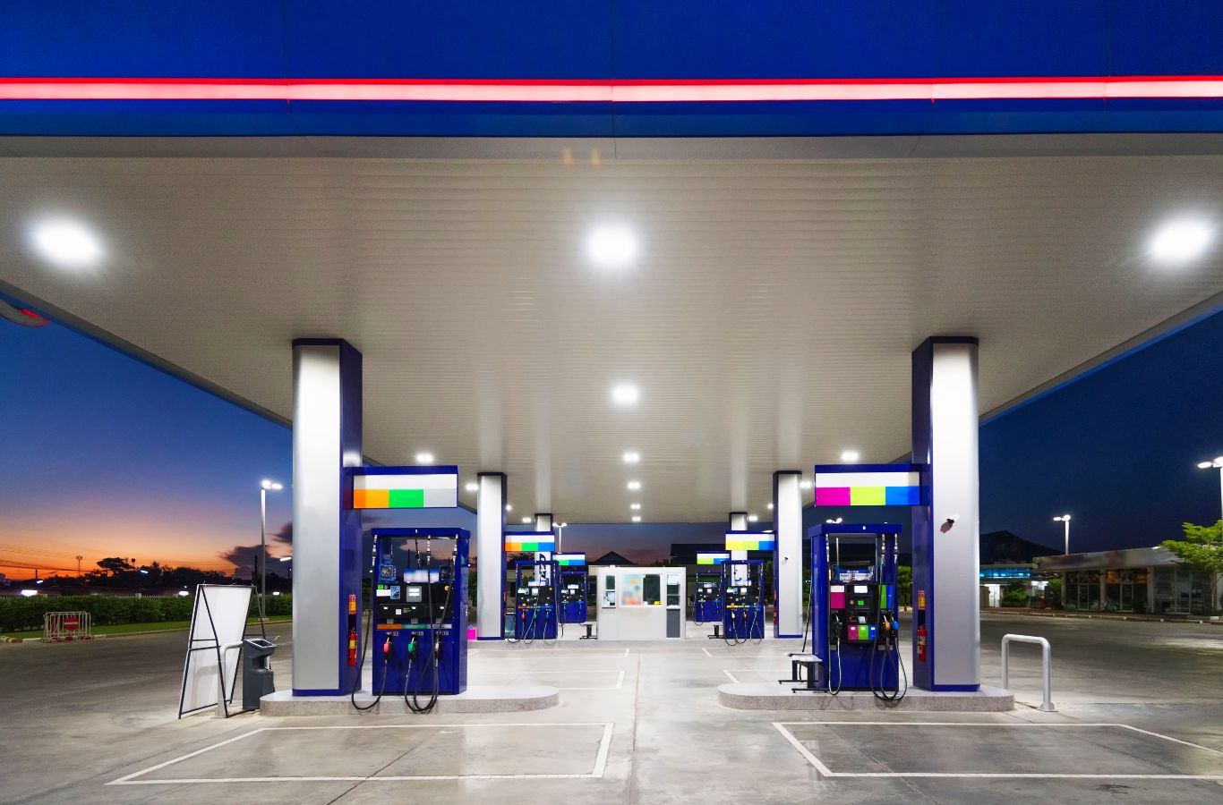 A Slon Exterior Care specialist performing gas station cleaning in San Jose, CA, ensuring a spotless and well-maintained fueling area.