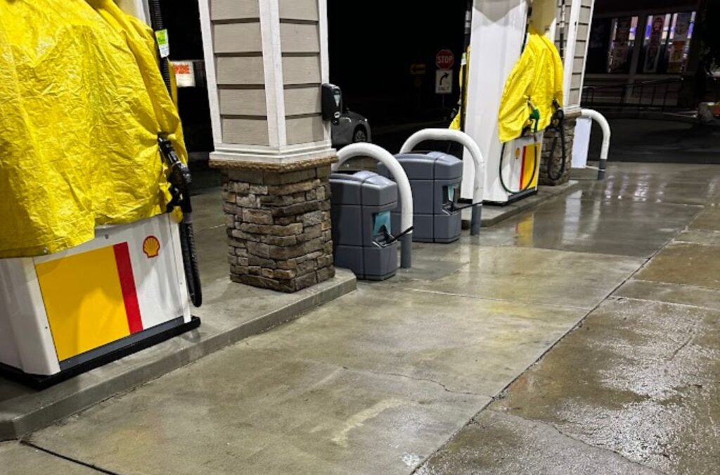 A Slon Exterior Care expert detailing a gas station island in Fremont, CA, illustrating our focused and experienced approach to station cleaning. Gas Station Cleaning near me.