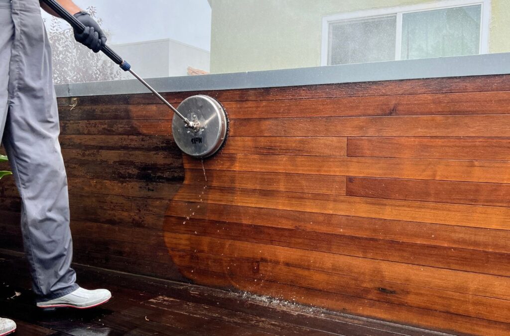 A Slon Exterior Care expert power washing outdoor furniture in Santa Clara, CA, emphasizing careful, efficient exterior cleaning methods. Power Washing near me.