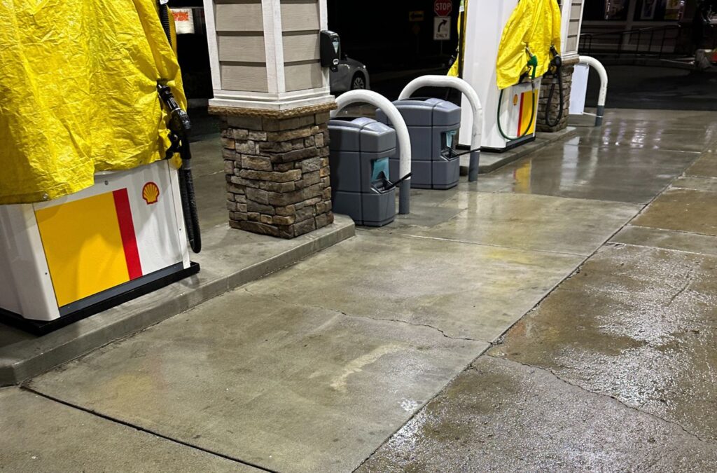 A Slon Exterior Care team member pressure washing a Newark, CA walkway using specialized equipment to ensure safe, high-quality cleaning.