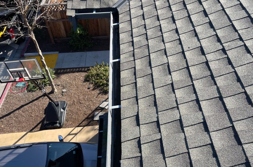 A Slon Exterior Care team member delivering gutter cleaning services in Newark, CA, illustrating the practical advantages of timely and professional gutter care.