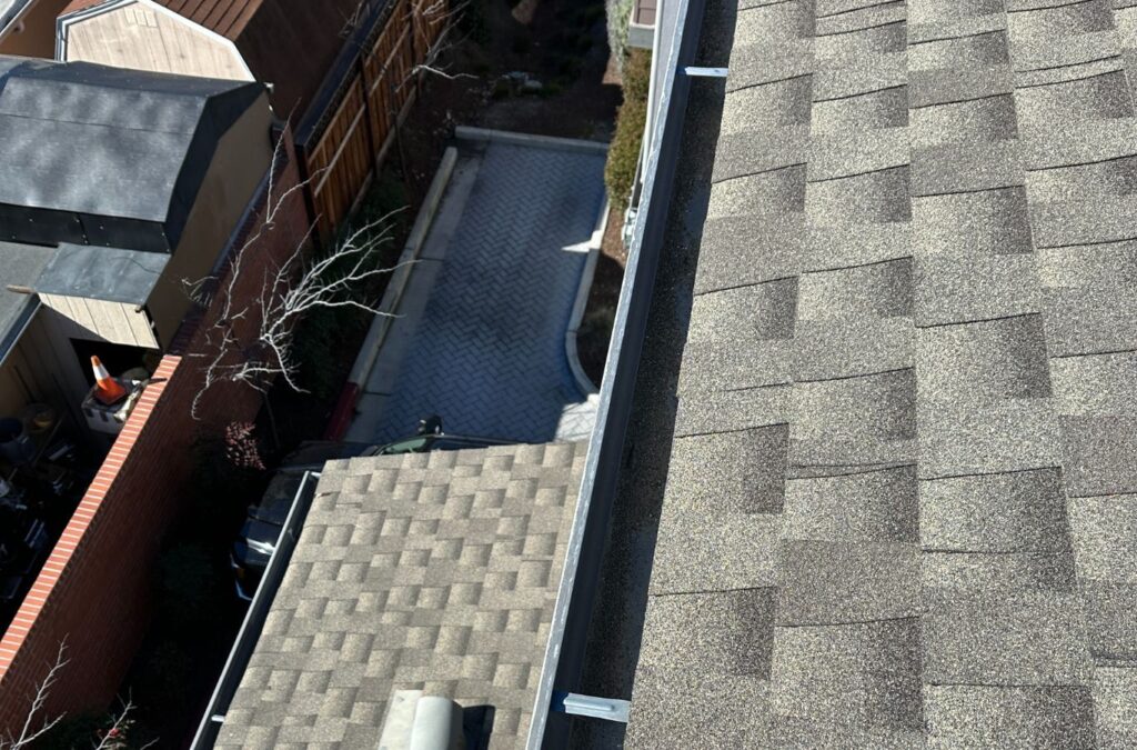 A Slon Exterior Care employee delivering expert gutter cleaning in Los Gatos, CA, using precision tools to maintain safe, debris-free water drainage.