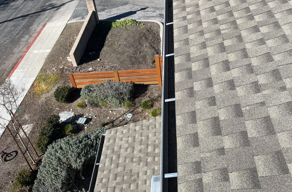 A Slon Exterior Care expert at work on gutter cleaning in Saratoga, CA, showcasing our commitment to excellence and tailored local service. Gutter Cleaning near me.