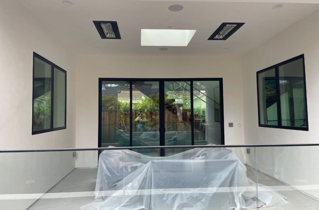 A Slon Exterior Care crew member showcasing window cleaning in Newark, CA and illustrating the advantages of hiring expert local services.