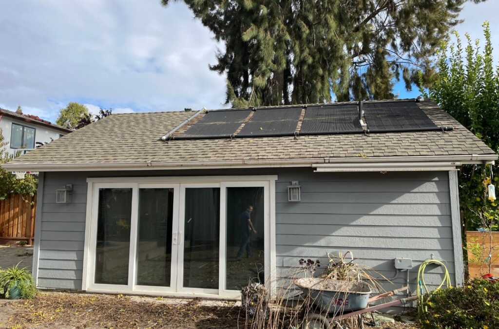 A Slon Exterior Care technician performing window cleaning in Newark, CA using high-quality tools to deliver spotless, clean windows.