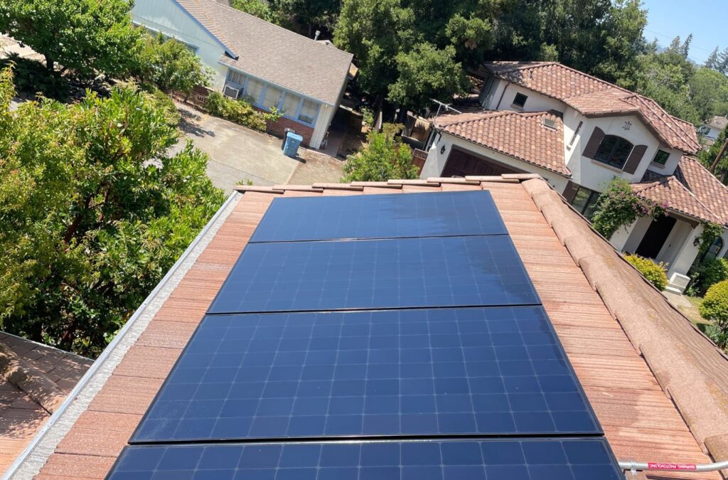 Slon Exterior Care worker performing Solar Panel Cleaning in Newark, CA with safe equipment for efficient, spotless energy panels.