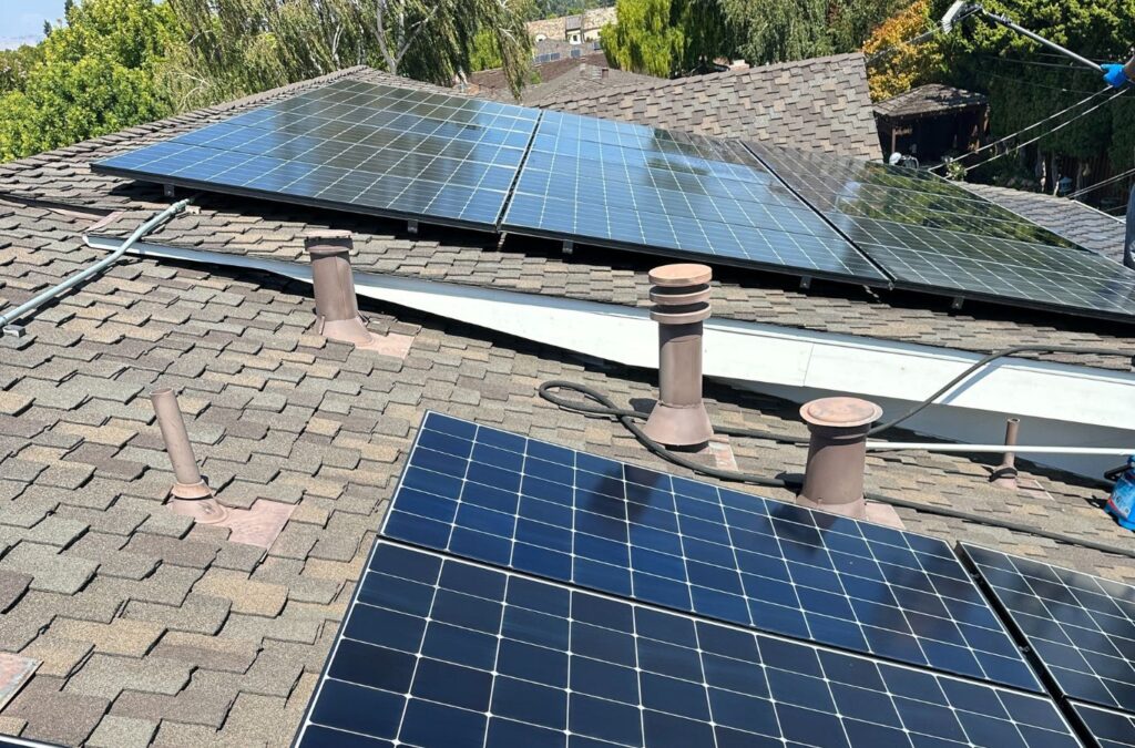 Slon Exterior Care employee cleaning solar panels in Redwood City, CA, ensuring maximum efficiency with professional equipment.