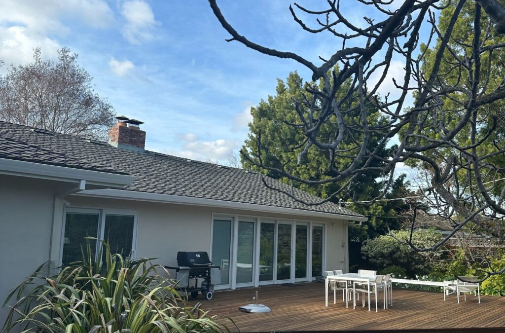 Slon Exterior Care team member providing roof cleaning in Sunnyvale, CA, showing the benefits of trusted local service